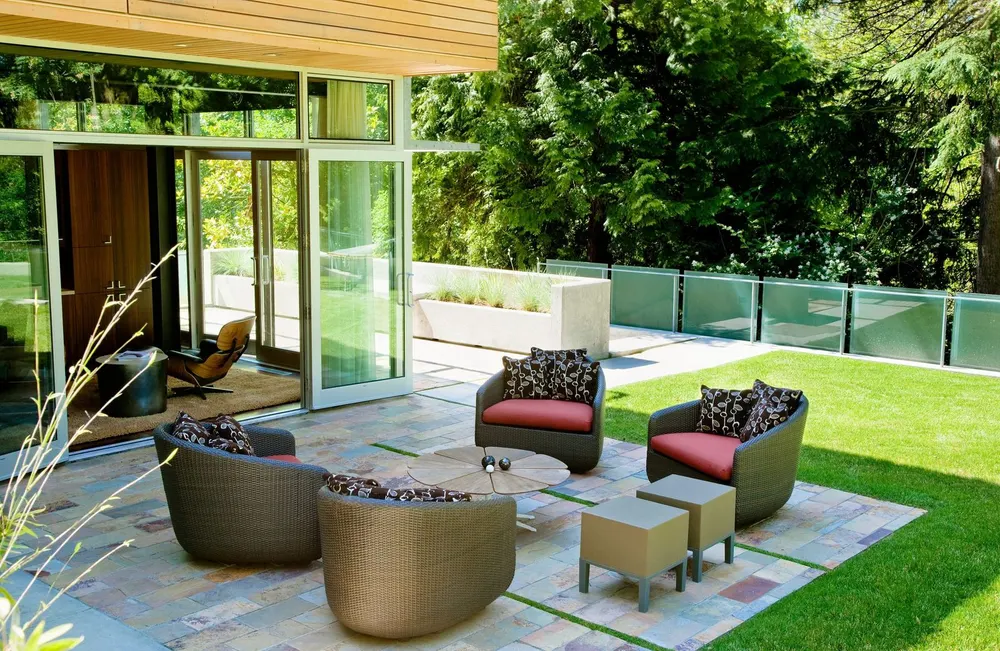 Finished backyard paver patio with seating area