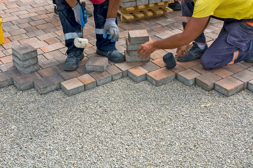 Landscaping crew working on a premium patio project