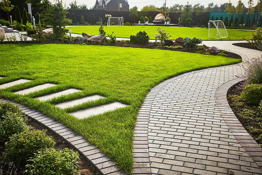 Stone retaining walls with integrated walkway and steps